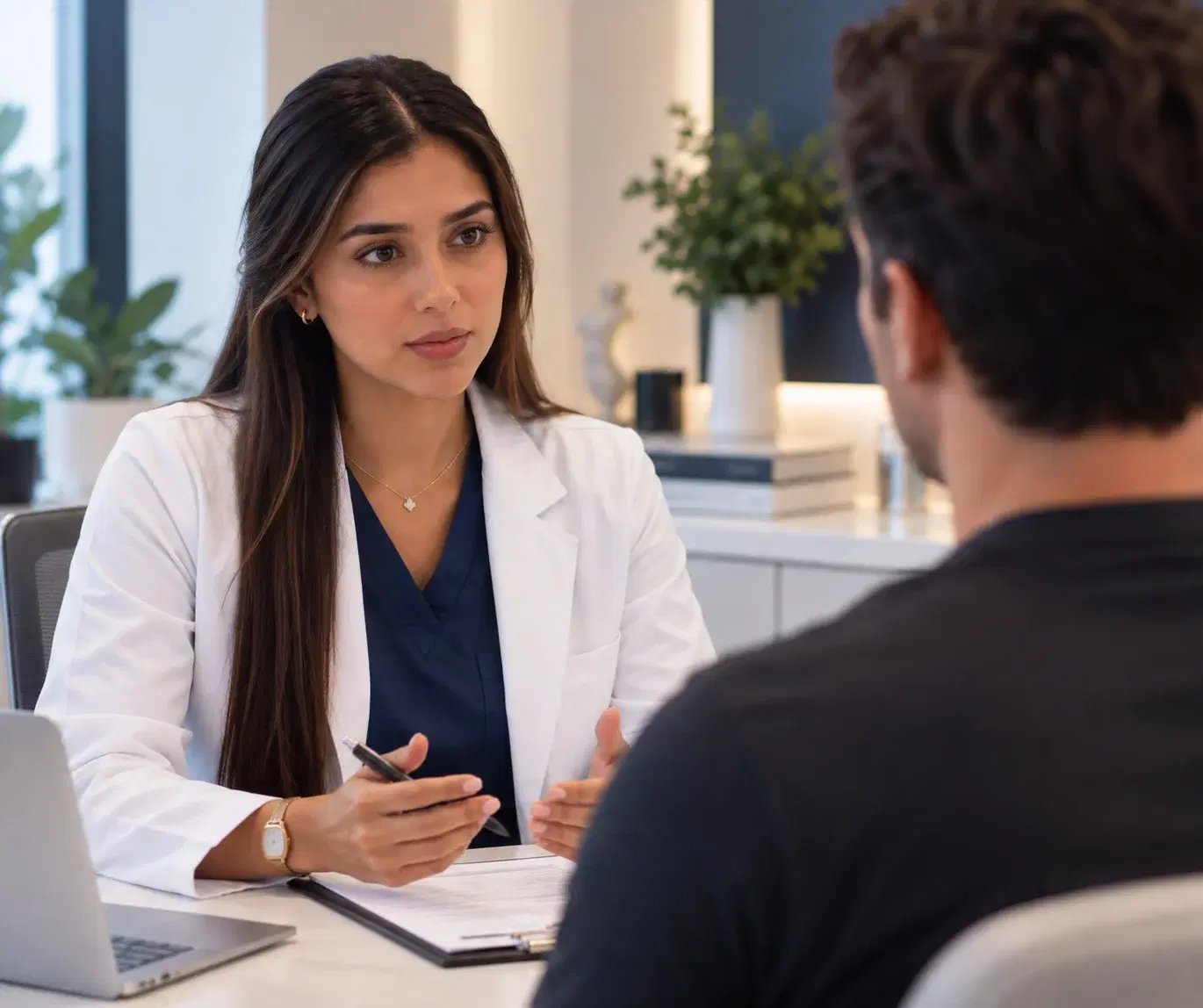 Provider listening to a patient during a wellness assessment